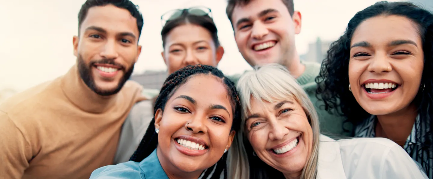 Friends laughing and showing healthy smiles